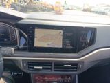 the dashboard of a car with a gps device in the center of it
