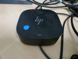 a black box with a blue button sitting on a table