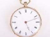 an antique pocket watch with roman numerals on the face