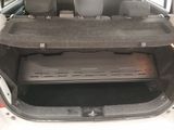 the back of a car with the trunk open and the seats down
