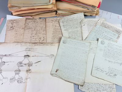 a pile of old papers sitting on top of a table