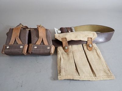 two pieces of luggage sitting next to each other on a table