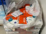 several bags of toilet paper are stacked on top of each other