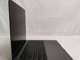 an open laptop computer sitting on top of a white surface