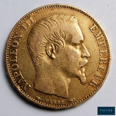 gros plan d'une pièce d'or sur laquelle figure le visage d'un homme