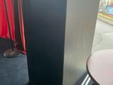 a black speaker that is sitting on a table