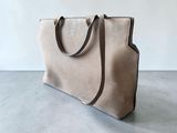 the small tote bag in tau sued with a leather strap
