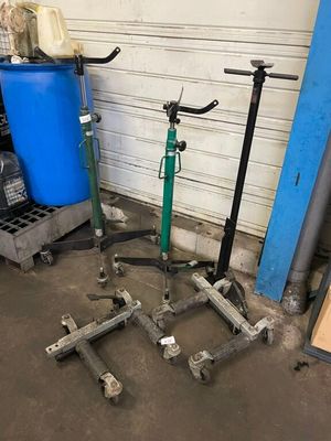 two scooters that are sitting next to each other in a garage