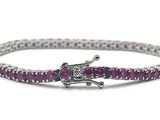a close up of a bracelet with a horse on it