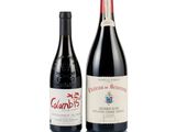 two bottles of wine sitting next to each other on a white surface