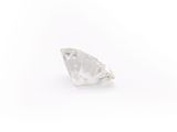 a close up of a single diamond on a white surface