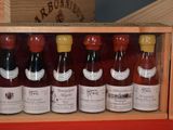 many bottles of wine in a wooden box