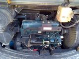 a small engine in the back of a truck