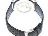 a close up of a watch on a white surface
