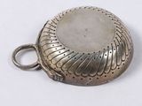 a silver pocket watch with a chain around it
