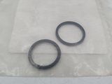 two rings on a piece of plastic on a table