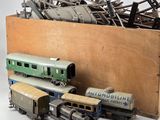 a box full of old model trains and other toy trains