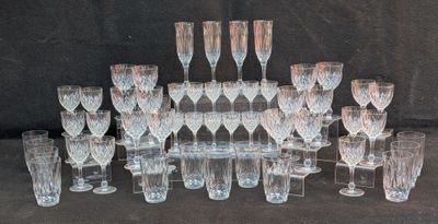 a lot of wine glasses that are sitting on the table