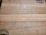 three wooden boards stacked on top of each other on a table