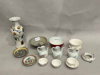 many different types of vases and bowls on the table