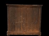 an old wooden cabinet with two doors and two drawers