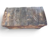 an old wooden box that is sitting on a white surface