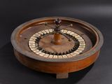 a wooden roule that is on a black surface