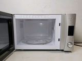 a microwave that is sitting on a counter next to a microwave oven