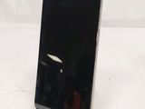 a cell phone that is sitting on top of a stand