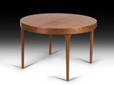 une table de salle à manger ronde à deux pieds, avec un plateau en bois