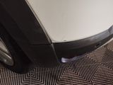 a close up of a car ' s bumper with a hole in it