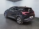 the rear end of a black car in a showroom