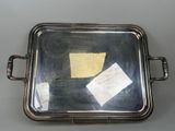 a silver tray with a piece of paper on it