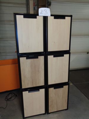 a refrigerator that has a lot of drawers in it