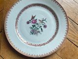 a white plate with a floral design on it