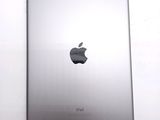 an apple ipad sitting on top of a white table next to a white wall