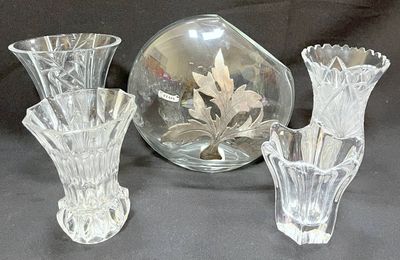 three glass vases sitting next to each other on a table