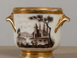 a vase that has a picture of a castle on it
