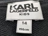 a close up of a label on the back of a black jacket