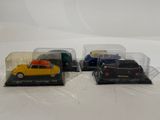 three toy cars that are sitting in a display case