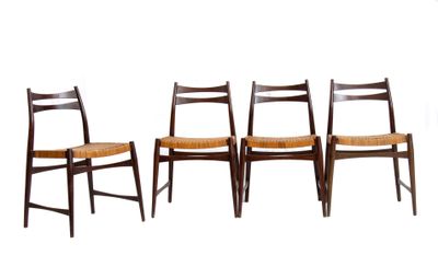 a set of four chairs with a woven seat and back