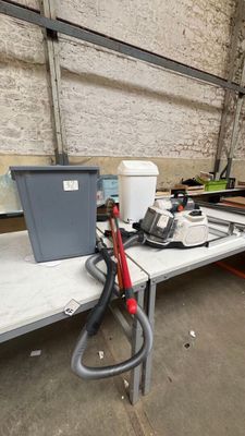 a lot of tools on a table in a warehouse
