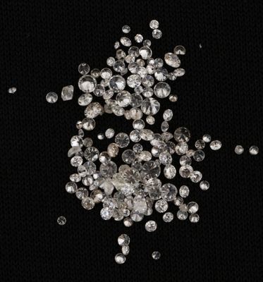 a pile of diamonds on a black background