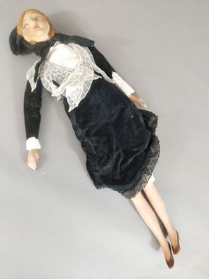a doll that is laying down on the floor