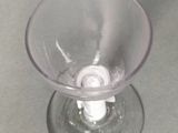 a wine glass that is sitting on a table