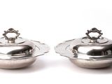 pair of silver plated sugar and pepper shakers on a white background