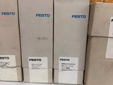 four boxes of festo coffee sit on a table next to a pair of scissors