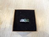 a ring that is sitting in a box on a table