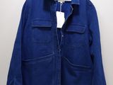 a close up of a blue jacket hanging on a hanger