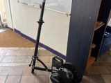 a scooter that is sitting on the ground in front of a door